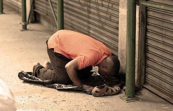 Praying on Sidewalk